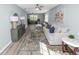 Expansive living room featuring contemporary decor, modern flooring, and great natural light from multiple windows at 1220 Woodland Ave, Lakeland, FL 33801