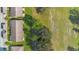 Overhead angle of well-maintained roofs in a quiet residential community bordered by green spaces at 2256 Firestone Pl, Winter Haven, FL 33884