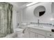 Clean bathroom with a shower/tub combo, vanity, and updated fixtures at 2256 Firestone Pl, Winter Haven, FL 33884