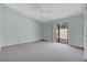 Light and airy bedroom with carpet and sliding door access at 2256 Firestone Pl, Winter Haven, FL 33884