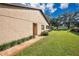 Exterior featuring well-maintained landscaping at 2256 Firestone Pl, Winter Haven, FL 33884