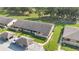 Attractive townhomes featuring a meticulously maintained lawn and convenient covered parking at 2256 Firestone Pl, Winter Haven, FL 33884