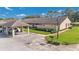 Inviting townhome with well-manicured front yard, covered parking, and classic design at 2256 Firestone Pl, Winter Haven, FL 33884