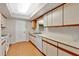 Efficient kitchen with light wood cabinets and appliances at 2256 Firestone Pl, Winter Haven, FL 33884