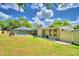 Landscaped backyard with pool and patio at 415 W Beacon Rd, Lakeland, FL 33803