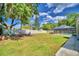Spacious backyard with seating area and pool at 415 W Beacon Rd, Lakeland, FL 33803