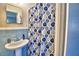 Simple bathroom with blue tile and shower curtain at 415 W Beacon Rd, Lakeland, FL 33803