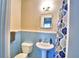 Clean bathroom with blue tile and pedestal sink at 415 W Beacon Rd, Lakeland, FL 33803