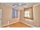 Well-lit bedroom with wood floors and ceiling fan at 415 W Beacon Rd, Lakeland, FL 33803