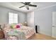 Spacious bedroom with floral bedding and built-in wardrobe at 415 W Beacon Rd, Lakeland, FL 33803