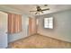 Light and airy bedroom with ceiling fan and neutral carpeting at 415 W Beacon Rd, Lakeland, FL 33803