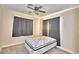 Simple bedroom with double bed and ceiling fan at 415 W Beacon Rd, Lakeland, FL 33803