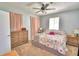 Main bedroom with king bed, dresser and ceiling fan at 415 W Beacon Rd, Lakeland, FL 33803