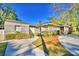 Charming ranch home with a long driveway and mature landscaping at 415 W Beacon Rd, Lakeland, FL 33803