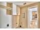 Laundry room with cabinets and access to kitchen at 415 W Beacon Rd, Lakeland, FL 33803