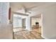 Open concept living area with tile floors and a view of the fireplace and kitchen at 415 W Beacon Rd, Lakeland, FL 33803