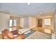 Spacious living room with a stone fireplace and large windows at 415 W Beacon Rd, Lakeland, FL 33803