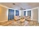 Bright living room with comfy sofas and tile floors at 415 W Beacon Rd, Lakeland, FL 33803