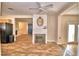 Living room features a brick fireplace and tile flooring at 415 W Beacon Rd, Lakeland, FL 33803