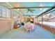 Covered patio with dining table and pool view at 415 W Beacon Rd, Lakeland, FL 33803