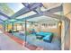 Covered patio with seating area, dining table, and outdoor grill at 415 W Beacon Rd, Lakeland, FL 33803