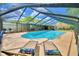 Inviting screened pool with lounge chairs at 415 W Beacon Rd, Lakeland, FL 33803