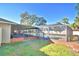 Enclosed rectangular pool with brick coping at 415 W Beacon Rd, Lakeland, FL 33803