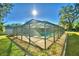 Enclosed rectangular swimming pool in backyard at 415 W Beacon Rd, Lakeland, FL 33803