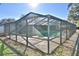 Enclosed rectangular swimming pool in backyard at 415 W Beacon Rd, Lakeland, FL 33803