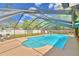 Relaxing screened pool with patio furniture at 415 W Beacon Rd, Lakeland, FL 33803