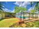 Inviting pool area with screened enclosure at 415 W Beacon Rd, Lakeland, FL 33803