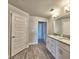 Bathroom features double sink vanity with granite countertops and modern fixtures at 4682 Grandview Glen Dr, Auburndale, FL 33823