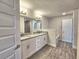 Bathroom featuring double sinks, granite countertop, tub and shower at 4682 Grandview Glen Dr, Auburndale, FL 33823