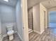 Bathroom featuring toilet and glass-enclosed shower at 4682 Grandview Glen Dr, Auburndale, FL 33823