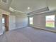 Spacious bedroom with gray walls, carpet and two large windows at 4682 Grandview Glen Dr, Auburndale, FL 33823