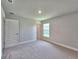 Bedroom featuring plush carpet, natural light and white trim at 4682 Grandview Glen Dr, Auburndale, FL 33823