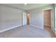Neutral bedroom features plush carpet, gray walls, white trim, and an open closet at 4682 Grandview Glen Dr, Auburndale, FL 33823