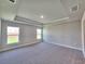 Spacious bedroom with gray walls, large windows and neutral carpeting at 4682 Grandview Glen Dr, Auburndale, FL 33823