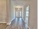 Inviting foyer with sleek wood-look flooring and neutral paint creates a bright and welcoming entrance at 4682 Grandview Glen Dr, Auburndale, FL 33823
