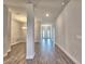 Open entryway with wood-look floors leading to the dining and living areas at 4682 Grandview Glen Dr, Auburndale, FL 33823