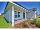 Home exterior with a tiled roof and covered entryway, complemented by neatly landscaped surroundings at 4682 Grandview Glen Dr, Auburndale, FL 33823