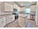 Well-equipped kitchen with granite countertops, stainless steel appliances and a functional island at 4682 Grandview Glen Dr, Auburndale, FL 33823