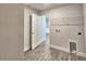 Laundry room with utility connections and wire shelving for storage at 4682 Grandview Glen Dr, Auburndale, FL 33823