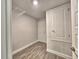 Storage closet with wire shelving in a neutrally painted room with wood-look floors at 4682 Grandview Glen Dr, Auburndale, FL 33823