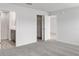 Bedroom with carpeted floors, a closet, and an ensuite bathroom at 559 Sw 77Th Cir, Ocala, FL 34474