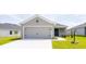 Charming single-Gathering home featuring a two-car garage and nicely manicured lawn at 559 Sw 77Th Cir, Ocala, FL 34474