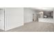 Open concept living space with wood grain flooring and neutral paint colors throughout at 559 Sw 77Th Cir, Ocala, FL 34474