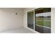 Covered patio with sliding glass door into the home at 559 Sw 77Th Cir, Ocala, FL 34474