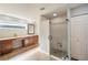 Spacious bathroom with double sinks, tile floors, bronze fixtures, and a large walk-in shower at 5009 Hanover Ln, Lakeland, FL 33813