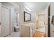 Well-maintained bathroom with a vanity sink and access to a shower, toilet, and additional room, offering convenience at 5009 Hanover Ln, Lakeland, FL 33813